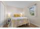 Well-lit bedroom featuring a window view and decorative bed spread and side table at 1160 Ida Ct, Greenwood, IN 46143