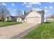 Well-maintained single-story home with an attached two-car garage and landscaped front yard at 1160 Ida Ct, Greenwood, IN 46143