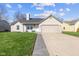Charming single-story home featuring a well-maintained lawn and attached two-car garage at 1160 Ida Ct, Greenwood, IN 46143