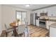 Modern kitchen with stainless steel appliances, granite countertops, and a breakfast nook, ideal for cooking and dining at 1160 Ida Ct, Greenwood, IN 46143