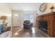 Inviting living room with hardwood floors, a cozy fireplace, and abundant natural light, perfect for relaxation at 1160 Ida Ct, Greenwood, IN 46143