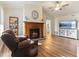 Cozy living room featuring a fireplace, hardwood floors and plenty of space for furniture and entertainment at 1160 Ida Ct, Greenwood, IN 46143