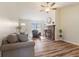 Inviting living room with hardwood floors, a cozy fireplace, and abundant natural light, perfect for relaxation at 1160 Ida Ct, Greenwood, IN 46143