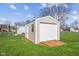 New shed in backyard features garage door, Personal door and wood ramp at 1160 Ida Ct, Greenwood, IN 46143