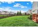 Well-maintained backyard featuring a large, grassy lawn and a wooden fence at 11629 Boothbay Ln, Fishers, IN 46037