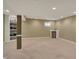 Finished basement with beige carpet, neutral paint, storage, and a beverage center at 11629 Boothbay Ln, Fishers, IN 46037