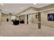 Large finished basement with columns, neutral colored walls and carpet, and ample space at 11629 Boothbay Ln, Fishers, IN 46037