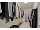 Walk-in closet with hanging clothes and shelving for optimal storage at 11629 Boothbay Ln, Fishers, IN 46037