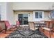 Wooden deck with seating, sliding glass door, black and white outdoor rug at 11629 Boothbay Ln, Fishers, IN 46037