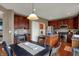 Eat-in kitchen with stainless steel appliances, granite countertops, and a dining area with a view at 11629 Boothbay Ln, Fishers, IN 46037