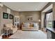 Comfortable living room featuring a neutral palette, area rug, and ample natural light at 11629 Boothbay Ln, Fishers, IN 46037