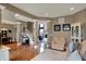Open-concept living room featuring hardwood floors, and view of the staircase at 11629 Boothbay Ln, Fishers, IN 46037