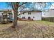 Wide shot of backyard with lawn, wood deck, a storage shed and playset at 12198 Blue Springs Ln, Fishers, IN 46037