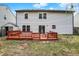 The backyard boasts a raised wood deck, sliding glass doors, vinyl siding and a small storage shed at 12198 Blue Springs Ln, Fishers, IN 46037