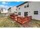 Back of home and wood deck, perfect for outdoor entertaining, with vinyl siding and a small storage shed at 12198 Blue Springs Ln, Fishers, IN 46037