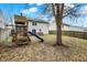 Fenced in backyard with lawn, playset and wood deck at 12198 Blue Springs Ln, Fishers, IN 46037