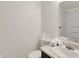 Compact bathroom features a sink with a vanity, a mirror, and a toilet at 12198 Blue Springs Ln, Fishers, IN 46037