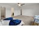Bright bedroom featuring plush carpeting, and access to a closet and en-suite bathroom at 12198 Blue Springs Ln, Fishers, IN 46037