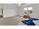 Bright bedroom showcasing carpet, a large window, and stylish decor at 12198 Blue Springs Ln, Fishers, IN 46037