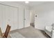 Bedroom with closet, interior hall access, and white armchair at 12198 Blue Springs Ln, Fishers, IN 46037