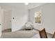 Bright bedroom with a white armchair, desk chair, and ample natural light at 12198 Blue Springs Ln, Fishers, IN 46037