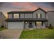 Attractive two-story house with a well-kept lawn, a two-car garage, and a welcoming entrance at 12198 Blue Springs Ln, Fishers, IN 46037