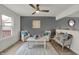 Cozy living room features neutral tones, comfortable seating, and a bright atmosphere with natural light at 12198 Blue Springs Ln, Fishers, IN 46037