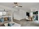 Inviting living room seamlessly connects to the dining area and the kitchen with modern decor at 12198 Blue Springs Ln, Fishers, IN 46037