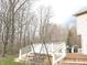 Inviting backyard deck featuring a swing and outdoor cooking area with a grill at 12441 Bent Oak Ln, Indianapolis, IN 46236
