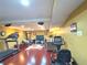 Basement gym with a treadmill, an elliptical and recreation room, featuring hard wood floors at 12441 Bent Oak Ln, Indianapolis, IN 46236