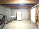 Unfinished basement with exposed ceiling and concrete walls, offering potential for customization at 12441 Bent Oak Ln, Indianapolis, IN 46236