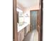 Bathroom featuring double sinks, decorative fixtures and tiled floors at 12441 Bent Oak Ln, Indianapolis, IN 46236