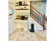 Charming coffee bar area with custom shelving and decor adjacent to the stairs at 12441 Bent Oak Ln, Indianapolis, IN 46236