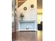 Welcoming foyer featuring an entryway table with flowers and decor, with a partial view of the living room at 12441 Bent Oak Ln, Indianapolis, IN 46236