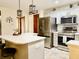Modern kitchen featuring stainless steel appliances, ample counter space, and stylish lighting at 12441 Bent Oak Ln, Indianapolis, IN 46236