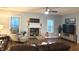Cozy living room with a brick fireplace, comfortable seating, and lots of natural light at 12441 Bent Oak Ln, Indianapolis, IN 46236