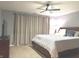 Spacious main bedroom with a ceiling fan, decorative pillows, and lots of natural light at 12441 Bent Oak Ln, Indianapolis, IN 46236