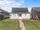 Backyard of a single-Gathering home with a patio and grassy area at 1313 W Memorial Dr, Muncie, IN 47302