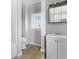Bathroom featuring a sleek vanity, natural light, and neutral color palette at 1313 W Memorial Dr, Muncie, IN 47302