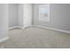 Cozy bedroom featuring plush carpeting, neutral-toned walls, and ample natural light at 1313 W Memorial Dr, Muncie, IN 47302
