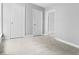 Comfortable bedroom with soft carpeting, neutral paint, and plenty of closet space at 1313 W Memorial Dr, Muncie, IN 47302
