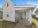 Charming single-Gathering home featuring a covered front porch, light gray siding, and a well-maintained lawn at 1313 W Memorial Dr, Muncie, IN 47302