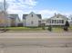 View of a single-Gathering home with a porch from across a street with traffic at 1313 W Memorial Dr, Muncie, IN 47302