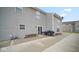 Spacious backyard with a concrete patio, a grill, benches, and durable siding at 1436 Amberwoods Ct, Indianapolis, IN 46239