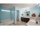 Bathroom featuring a double vanity and separate tub and shower at 1436 Amberwoods Ct, Indianapolis, IN 46239
