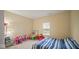 Bedroom featuring carpeted floors, bright paint, and a window for natural light at 1436 Amberwoods Ct, Indianapolis, IN 46239