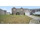 Two-story home featuring a well-maintained lawn and a two-car garage at 1436 Amberwoods Ct, Indianapolis, IN 46239