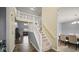 Spacious foyer featuring a staircase, access to the dining room, and an open view of the living area at 1436 Amberwoods Ct, Indianapolis, IN 46239