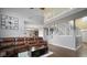 Open-concept living area with hardwood floors and a staircase to the second level at 1436 Amberwoods Ct, Indianapolis, IN 46239