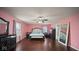 Spacious primary bedroom with hardwood floors and stylish furnishings at 1436 Amberwoods Ct, Indianapolis, IN 46239